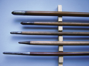 Four early 19th century brazed piles, showing variations in shape